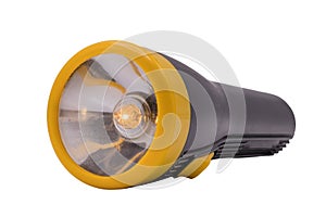 A yellow flashlight torch isolated on white background and with clipping path.