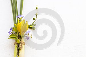 Yellow flowers ylang ylang ,purple flowers and lemon grass local flora of asia decoration flat lay postcard style style