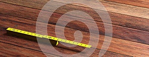 Yellow folding wooden ruler isolated on wooden background, banner, copy space. 3d illustration