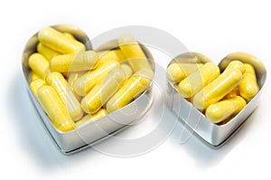 Yellow food supplemnet CoQ10 (Co-enzyme Q10) capsules