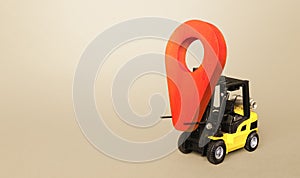 Yellow forklift carries a red location pointer. Transportation services and logistics management warehouse. Destination cargo