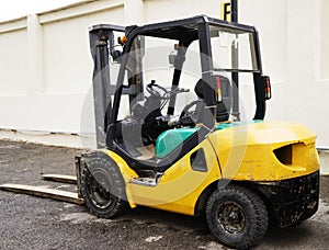 Yellow Forklift stands on a construction site