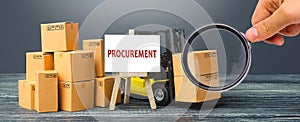 Yellow Forklift truck with cardboard boxes and stand with the word Procurement. Logistics, warehousing, transportation of goods, photo