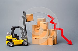 Yellow Forklift truck truckraises a box over a stack of boxes and red arrow down. Decrease in economic rates, low demand for goods