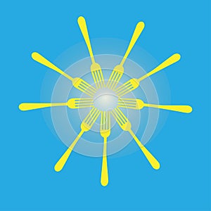 Yellow forks arranged in shape of a sun on blue background