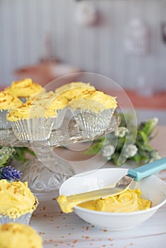 Yellow Frosted Cupcakes in Silver cupcake paper