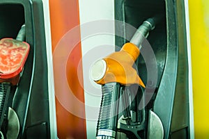 Yellow fuel oil dispenser at petrol filling station. Fuel dispensing pump at a gas station