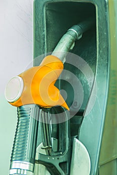 Yellow fuel oil dispenser at petrol filling station. Fuel dispensing pump at a gas station