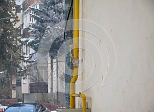 Yellow gas pipe connection on tower building