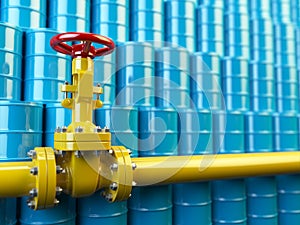 Yellow gas pipe line valves and blue oil barrels. Fuel and energy industrial concept.