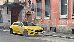 yellow german compact design sport city car parked in the street