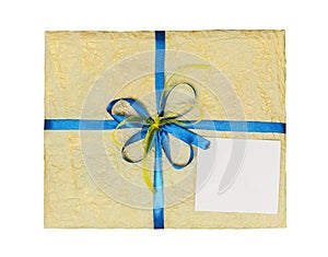 The yellow gift which is elegantly packed into crumpled paper