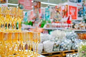 Yellow Glass goblets on a blurry Christmas background