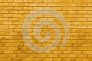 Yellow gold brick wall abstract texture background