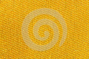 Yellow gold canvas fabric texture background. Textile and decoration concept. Wallpaper and interior design