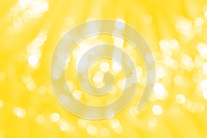 Yellow or gold sparkle glitter abstract bokeh patterns on background