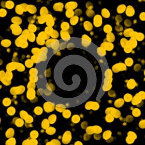 Yellow or golden dot or point on the dark or black background with copy space in the middle center.