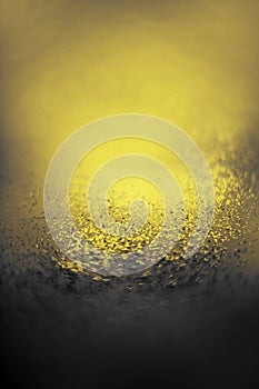 Yellow-gray abstract background with small bokeh defocused lights