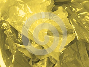 Yellow and gray plastic bag pieces
