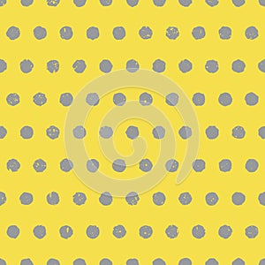 Yellow and gray textured polka dot background in colors of the year 2021. Seamless pattern with gray circles
