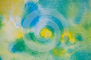 Yellow, green and blue watercolor brush strokes. Background for design. Colorful hand painted watercolor background.