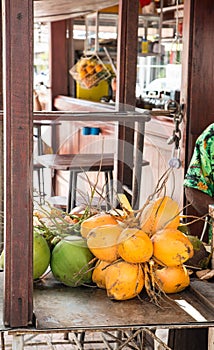 Yellow and Green Coconuts in a Market