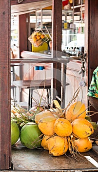 Yellow and Green Coconuts in Market