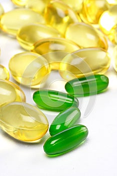 Yellow and green cod liver oil pills