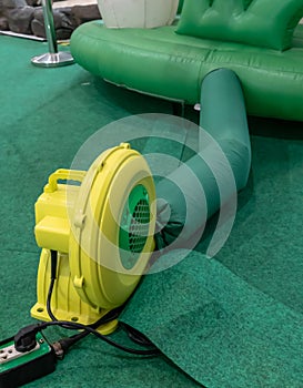 Yellow and green electric air blower for commercial inflatable bouncer and slide