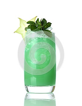 Yellow green mojito cocktail decorated with star tropical fruit in high ball cocktails glass isolated on white