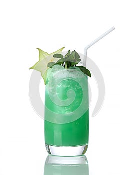 Yellow green mojito cocktail decorated with star tropical fruit with straw in high ball cocktails glass isolated on white