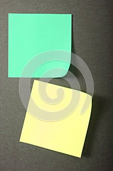 Yellow and green note paper