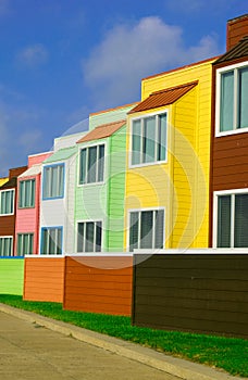 Yellow, green, red and pink condominiums