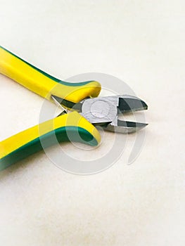 Soft grip wire cutting pliers on a white isolated background.