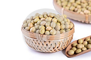 Yellow-green Taiwanese organic non-GMO soybeans, soy beans in a container isolated on white backgorund, close up, clipping path