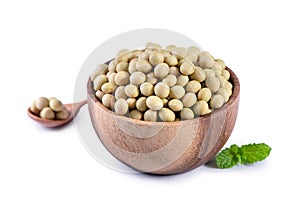 Yellow-green Taiwanese organic non-GMO soybeans, soy beans in a container isolated on white backgorund, close up, clipping path