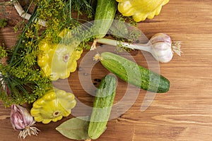 Yellow and green vegetables on a brown wooden background