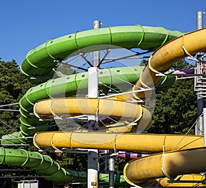 Yellow and green water slide in aquapark
