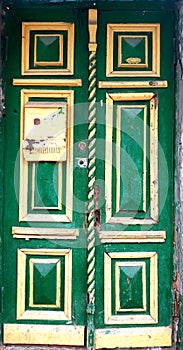 Yellow-green wooden doors with thread photo