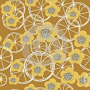 Yellow,grey and white flowers and lemons on brown background sea