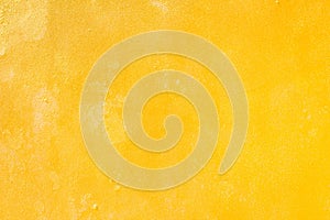 Yellow grunge cement wall, textured background