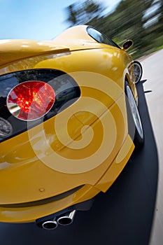 Yellow GTO Sports Coupe Car In Motion