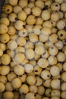 yellow guavas on the shelf of a supermarket or grocery store. Typical tropical fruit in Latin America, rich in vitamins c