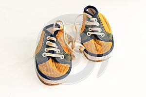 Yellow gumshoe on white background