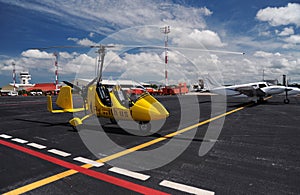 Yellow gyroplane in the international airport photo