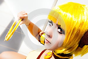 Yellow hair. Cosplay girl, costume cartoon Japanese manga.