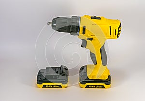 Yellow hand-held cordless screwdriver