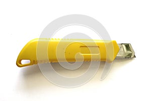 Yellow handle cutter knife white background