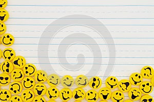 Yellow happy buttons border on lined paper