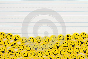 Yellow happy buttons border on lined paper